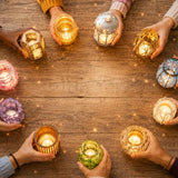 Diverse group of people holding glowing candles together in a circle, representing individual spiritual gifts, community, and honoring each person’s unique path.